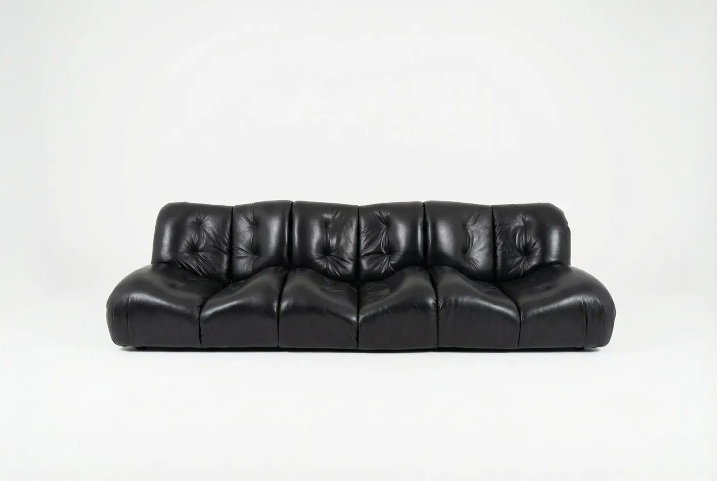 Low black leather sofa